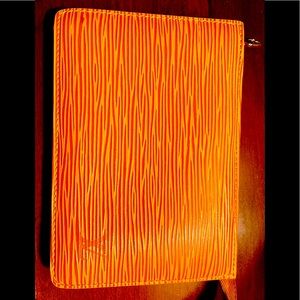 Louis Vuitton yellow ESI ladies wallet like new .